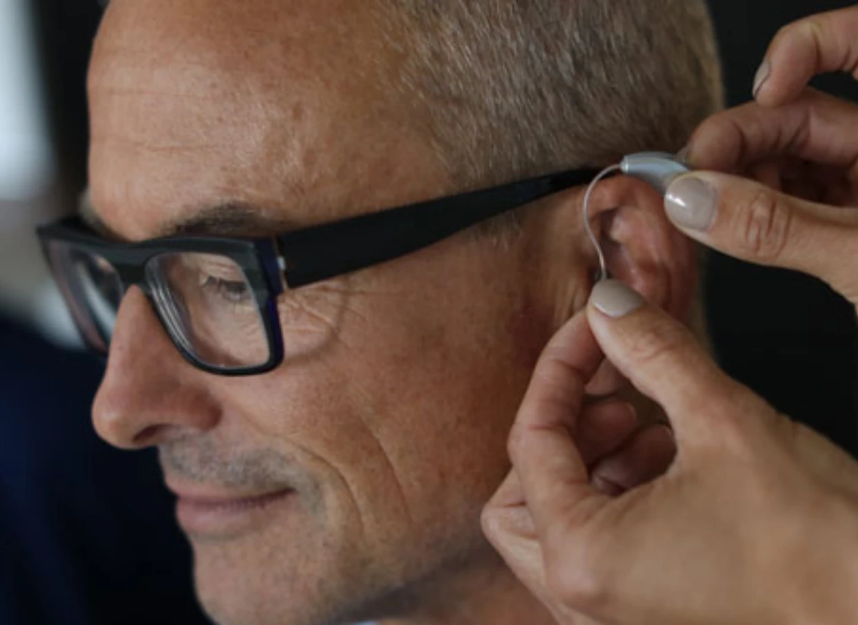 Man has hearing aid fitted