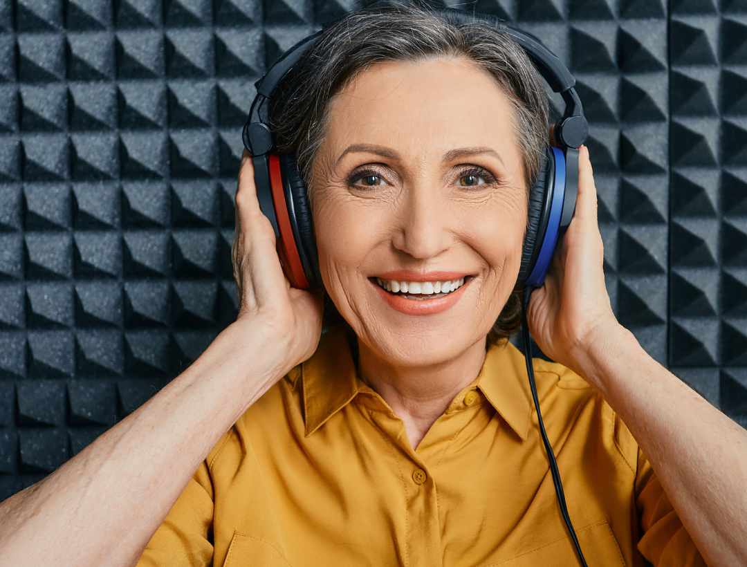 Woman with earphones on for hearing test