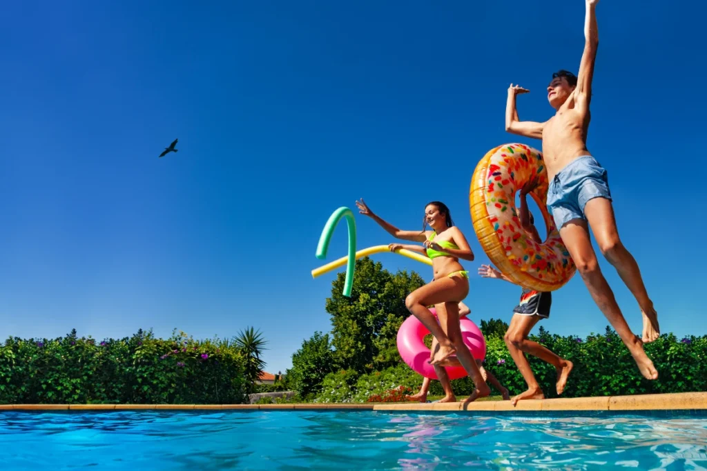 FMHC kids jumping into swimming pool