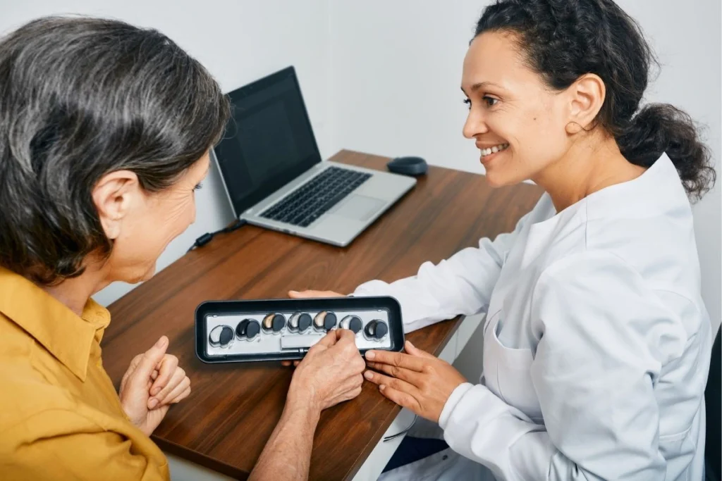 Woman choosing hearing aid-Why Treating Hearing Loss Early Leads to Better Outcomes
